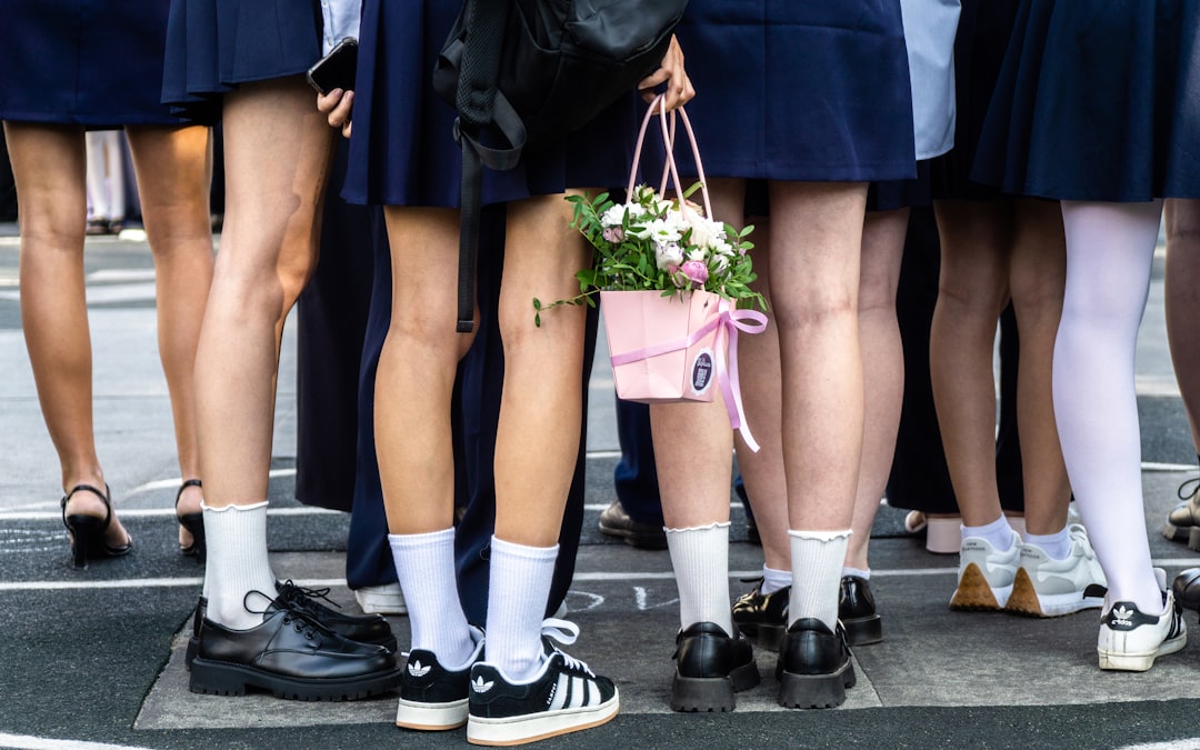 a-group-of-people-standing-next-to-each-other-6hwi9h7kq8